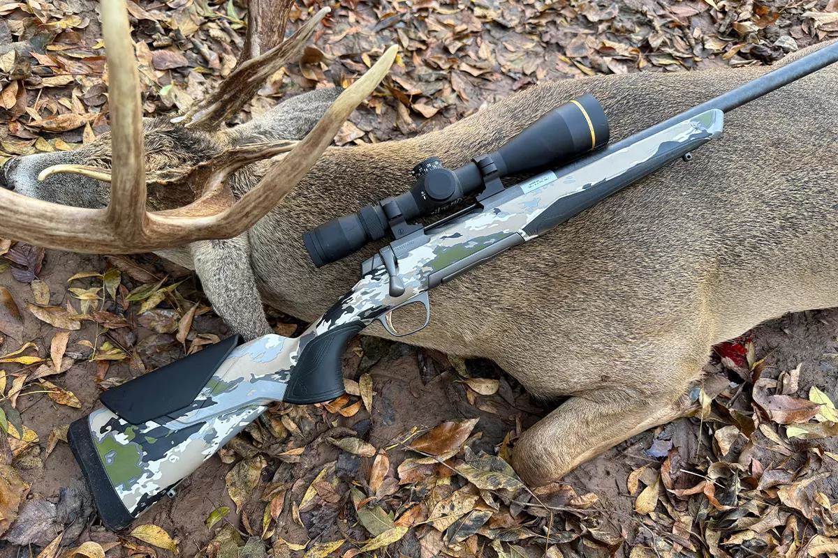 Leupold VX-4HD and Browning X-Bolt 2 rifle laid over a whitetail buck