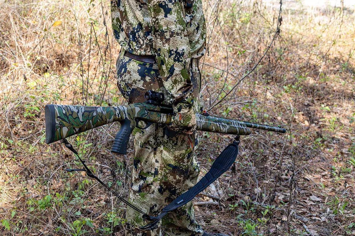 Turkey hunter carrying Mossberg International SA-28 Tactical Turkey shotgun.