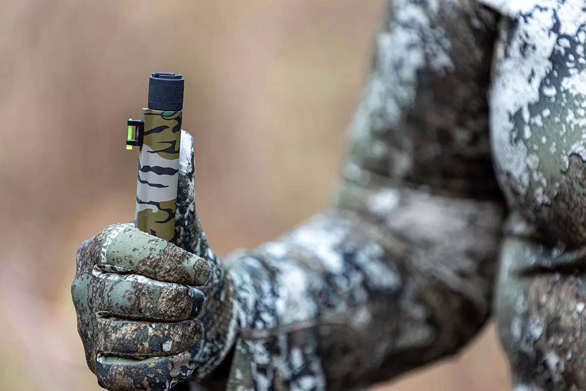 Close-up shot of an extended Turkey choke tube on a shotgun.