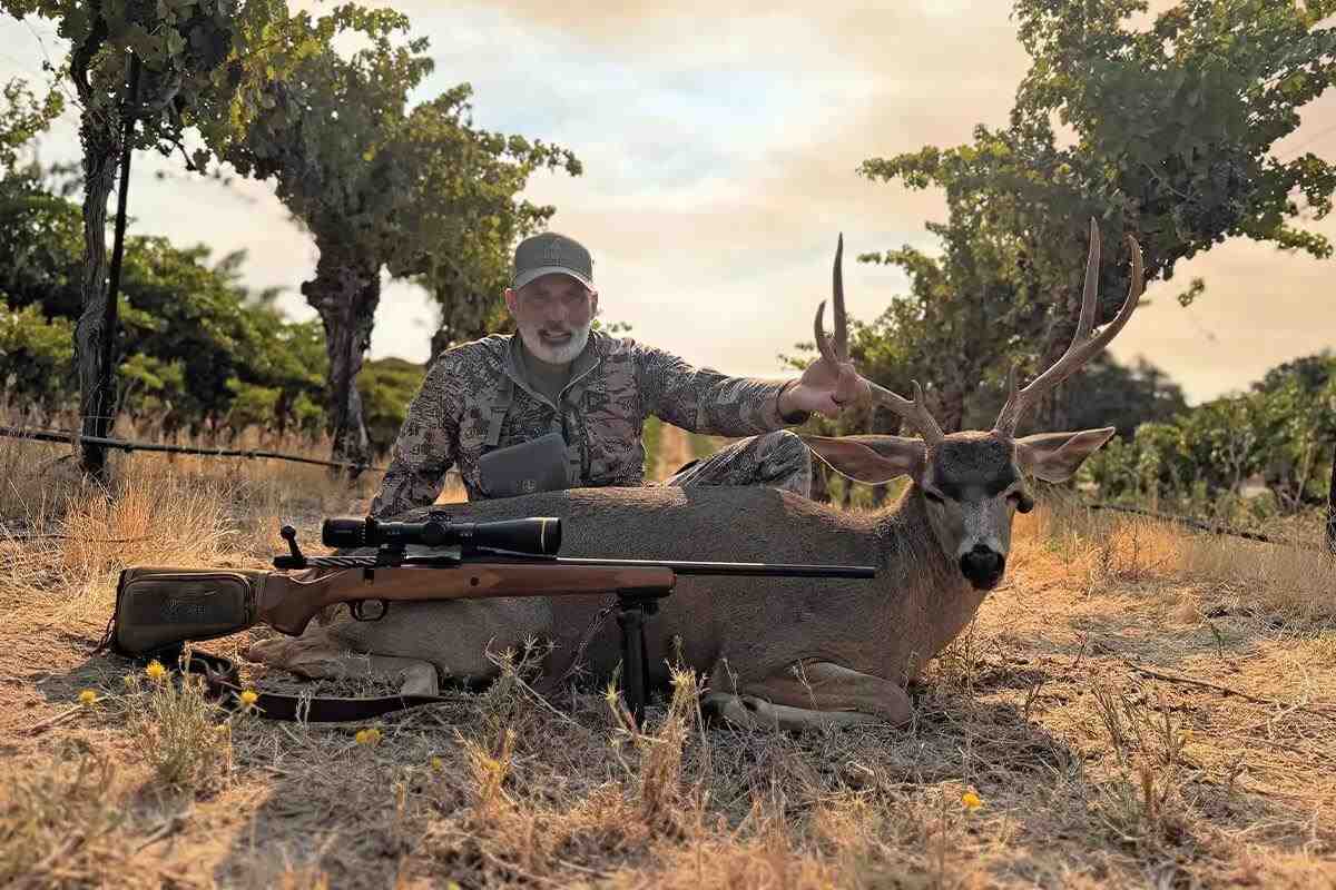 hunter with buck