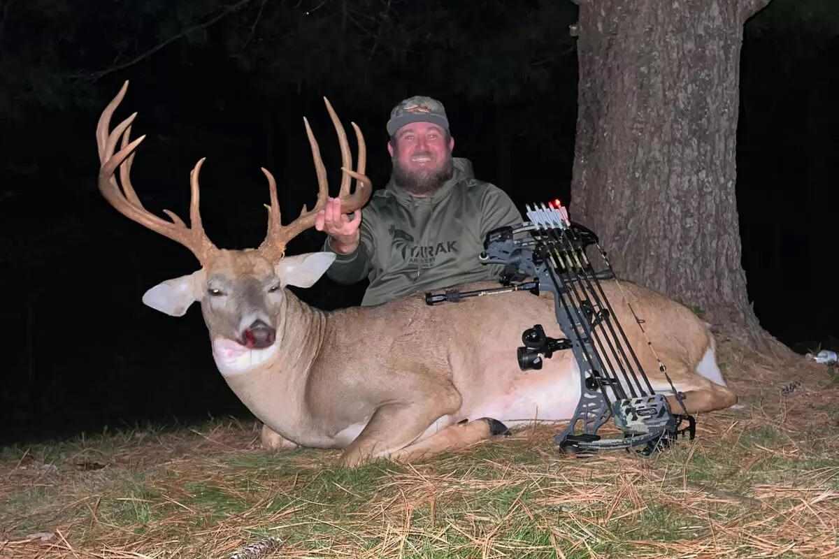 bowhunter with downed Ohio whitetail buck