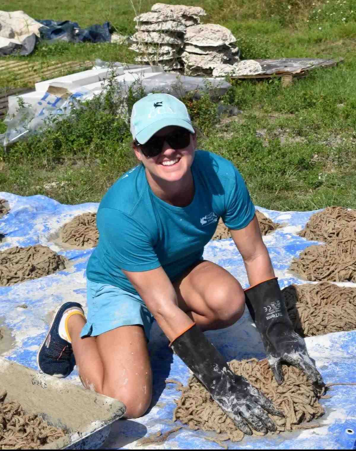 woman molding concrete oyster ring