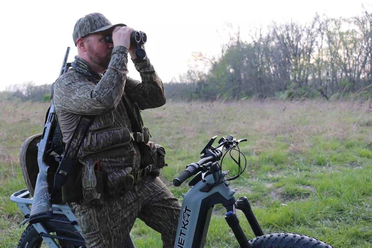 A turkey hunter glasses the area for any strutting toms. 