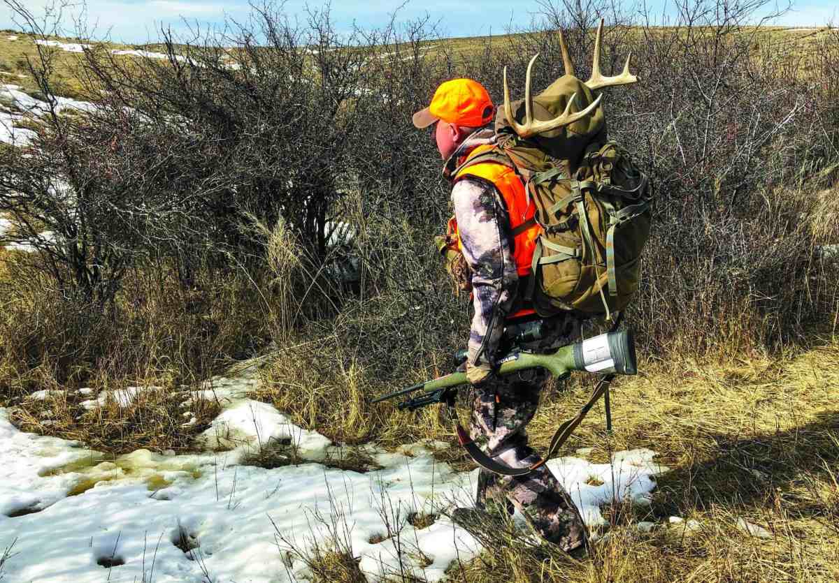 rw1212_packing_out_a_whitetail_after_a_hunt_copyright_mark_kayser