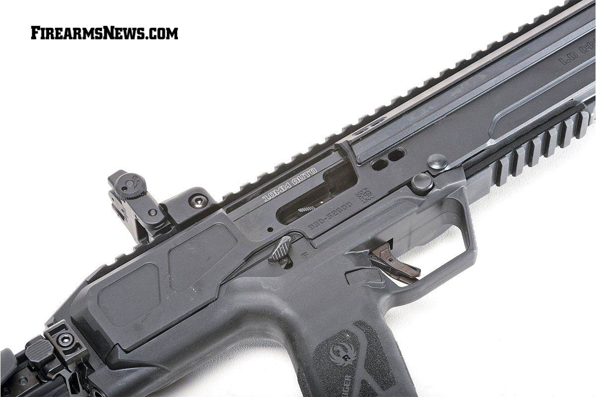 Rear sight and thumb safety