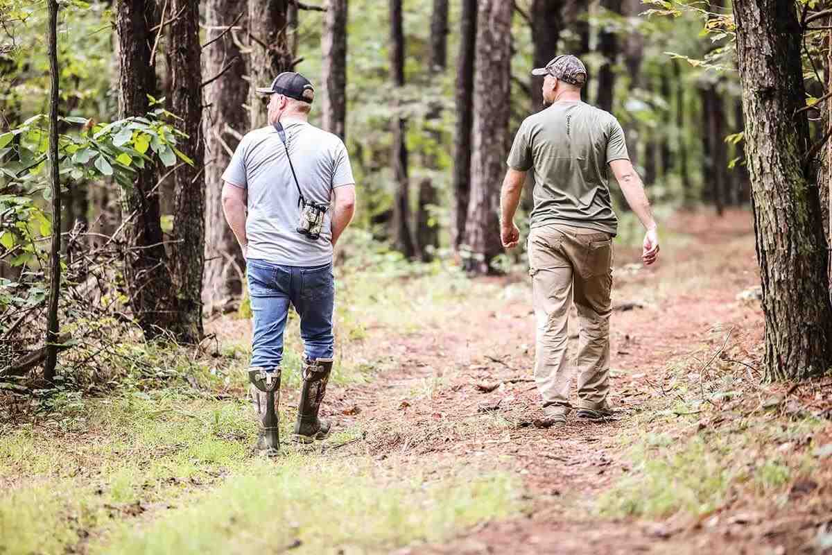 two hunters walking