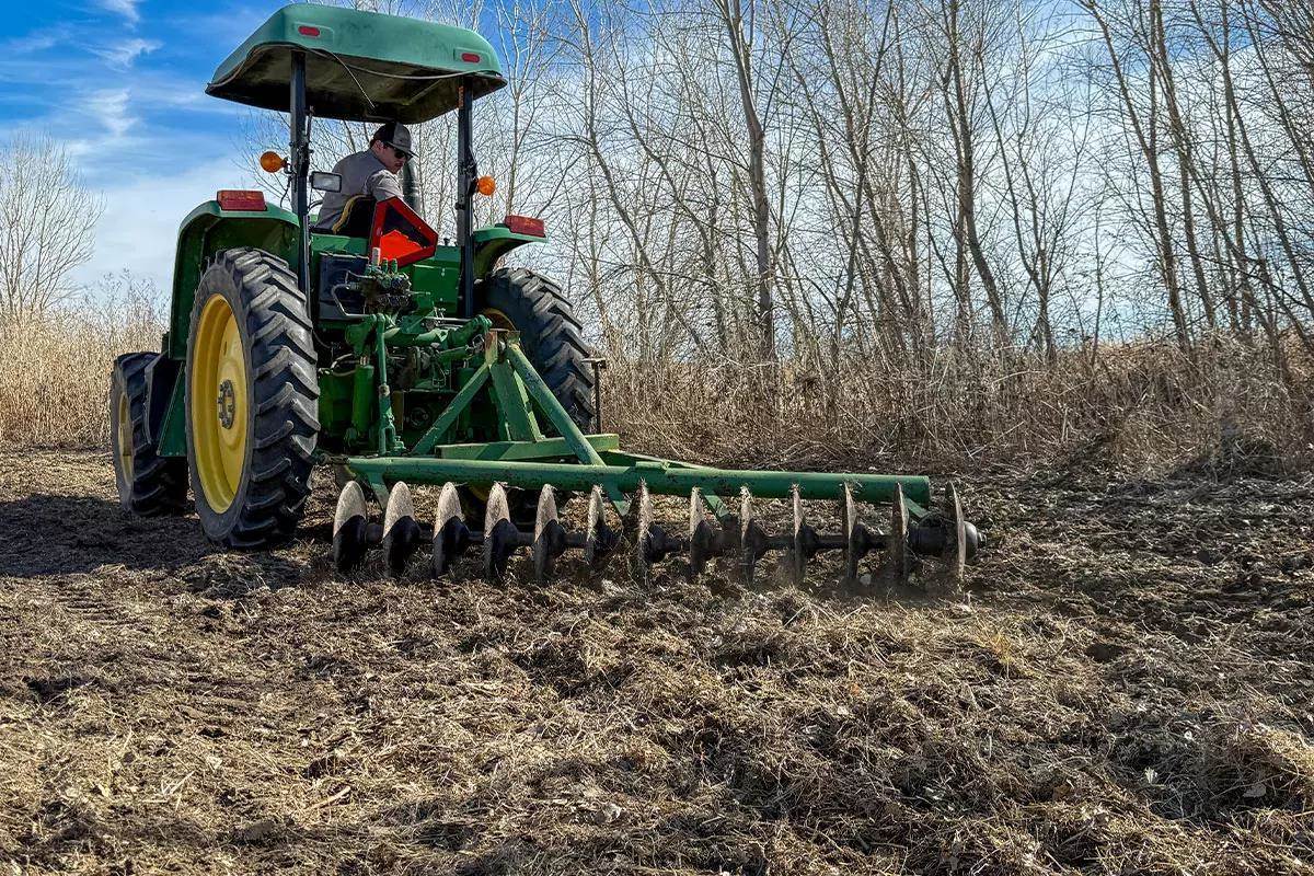 Tractor discing field