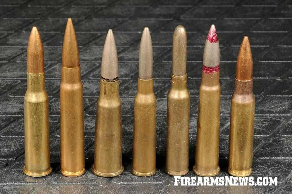 A line-up of various military rifle cartridges on a black background 