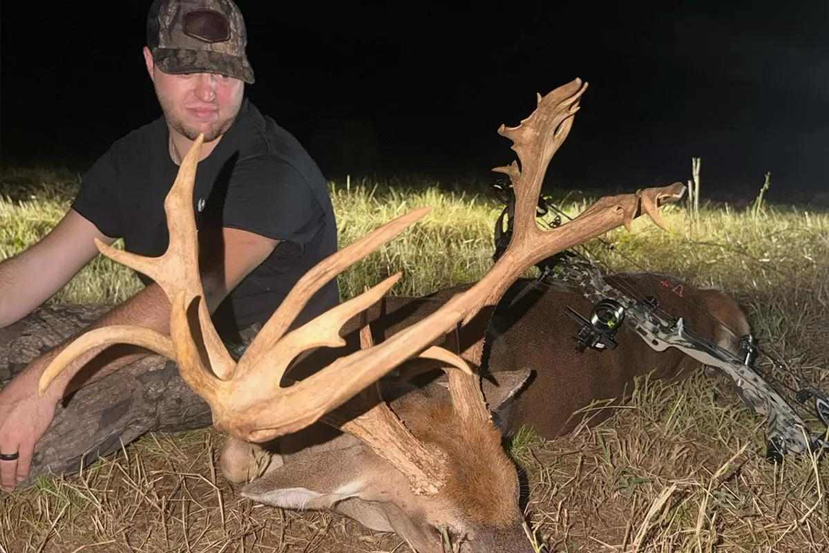 Hunter with buck
