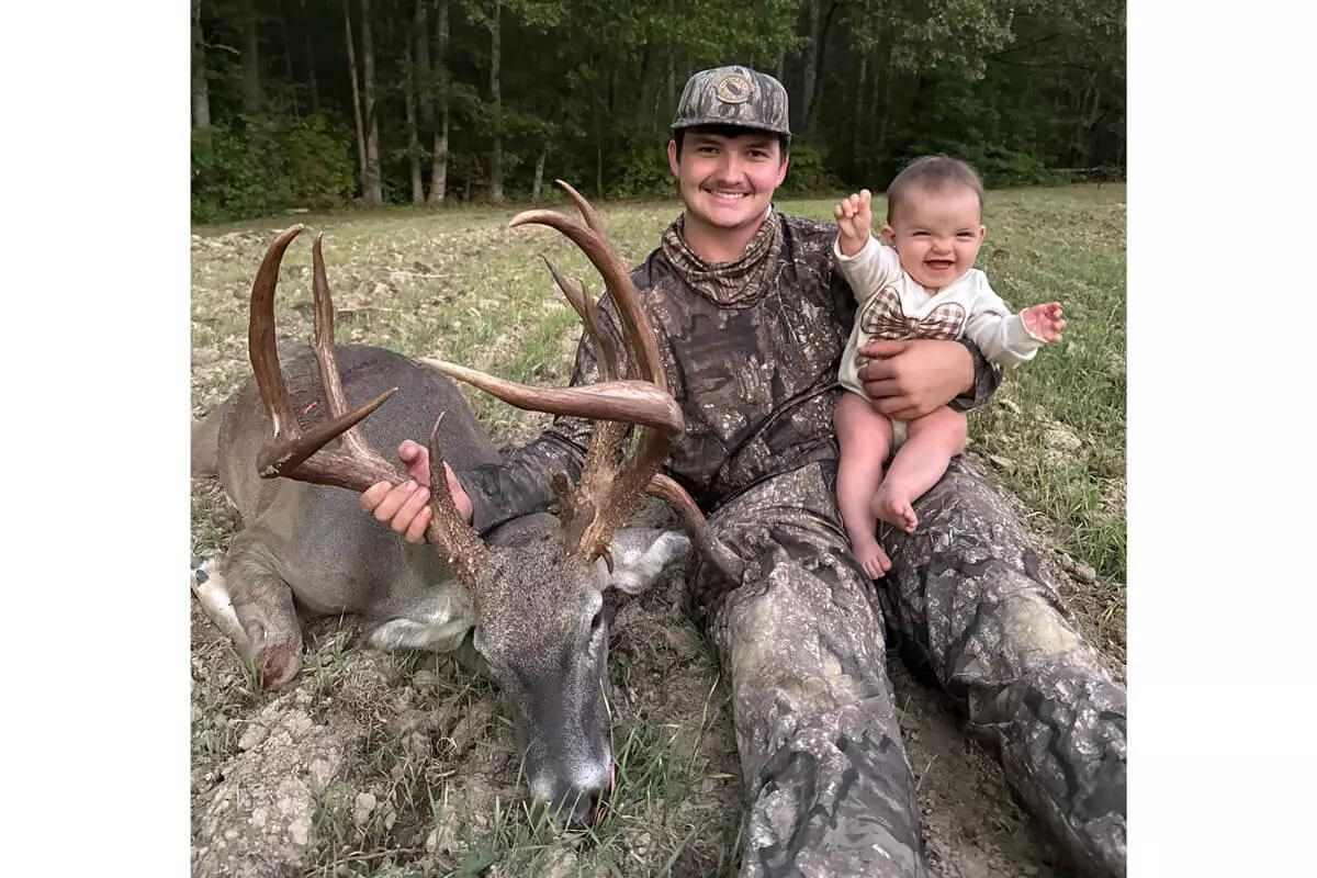 Tennessee whitetail buck with bowhunter and child