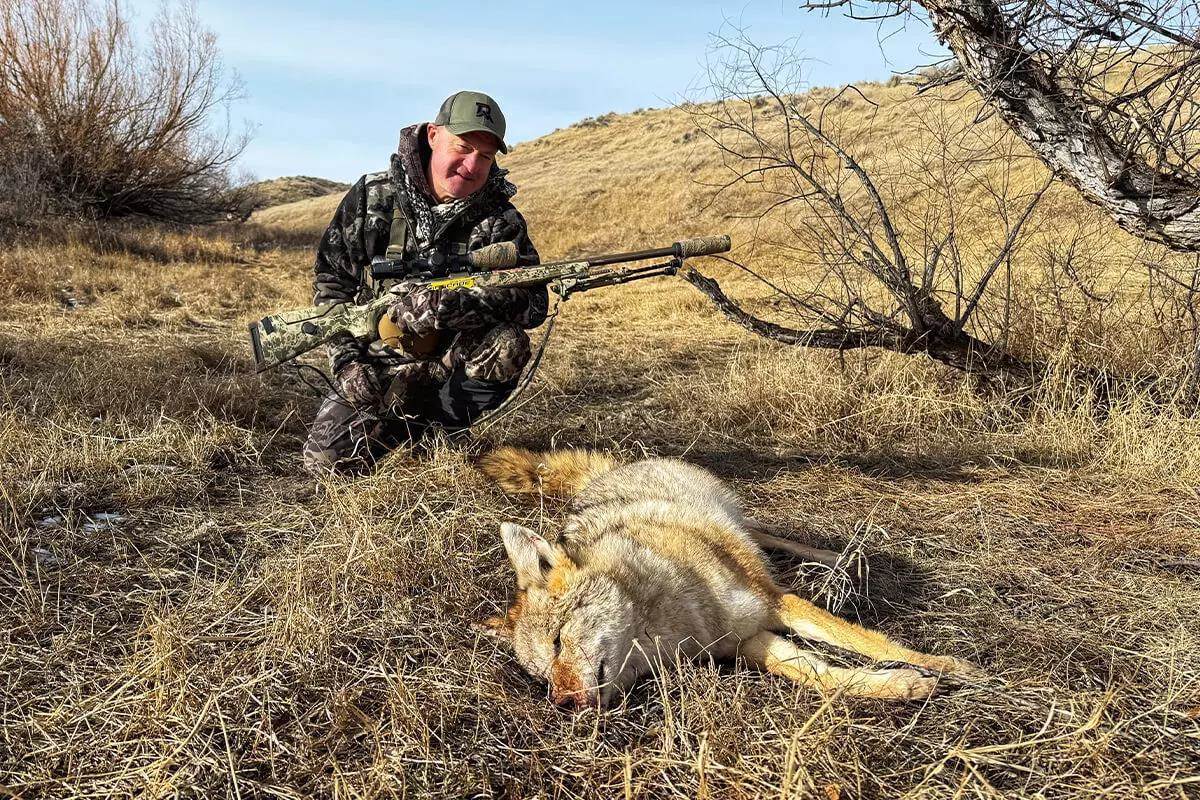 hunter staring at coyote