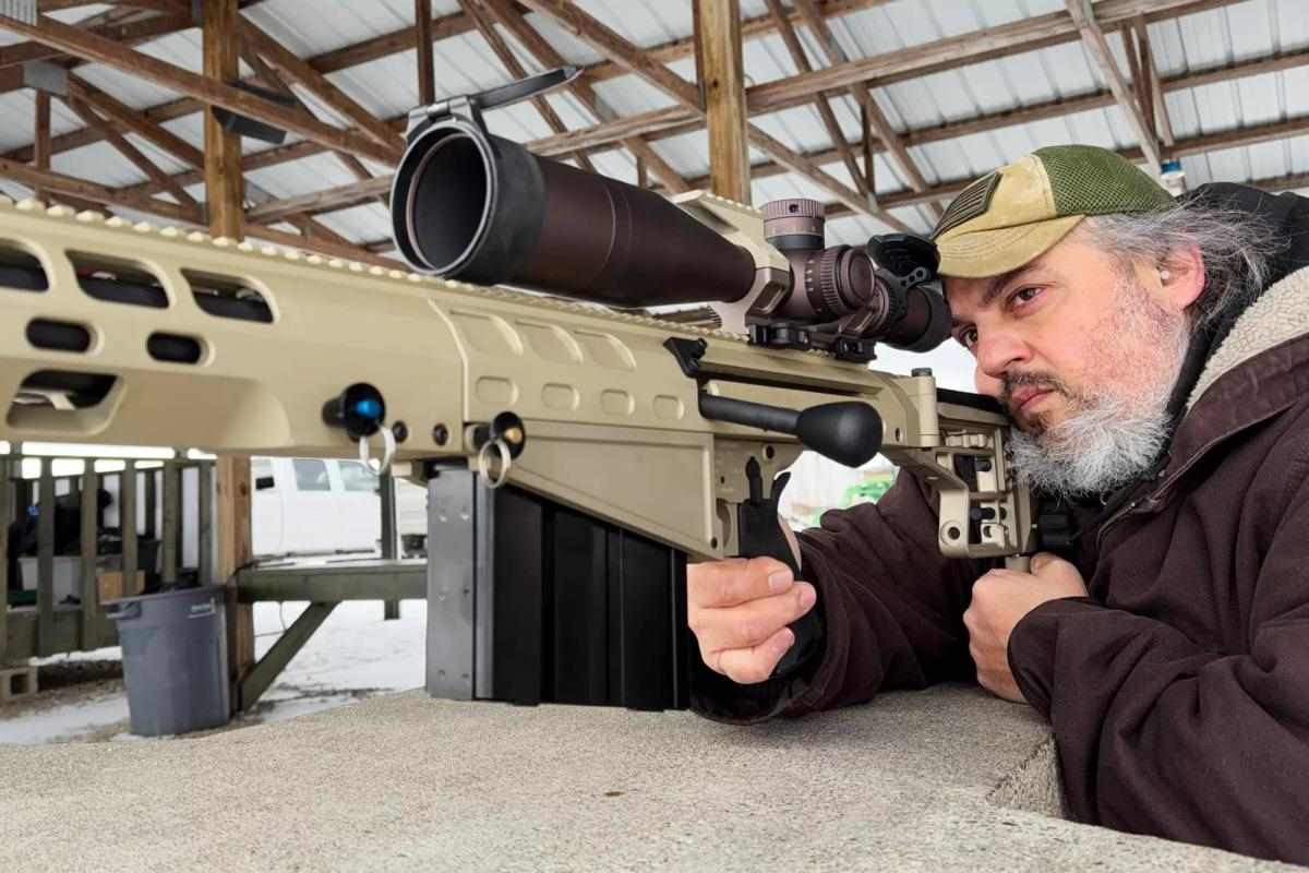 man shooting the Auto-Ordnance Thompson TAO50