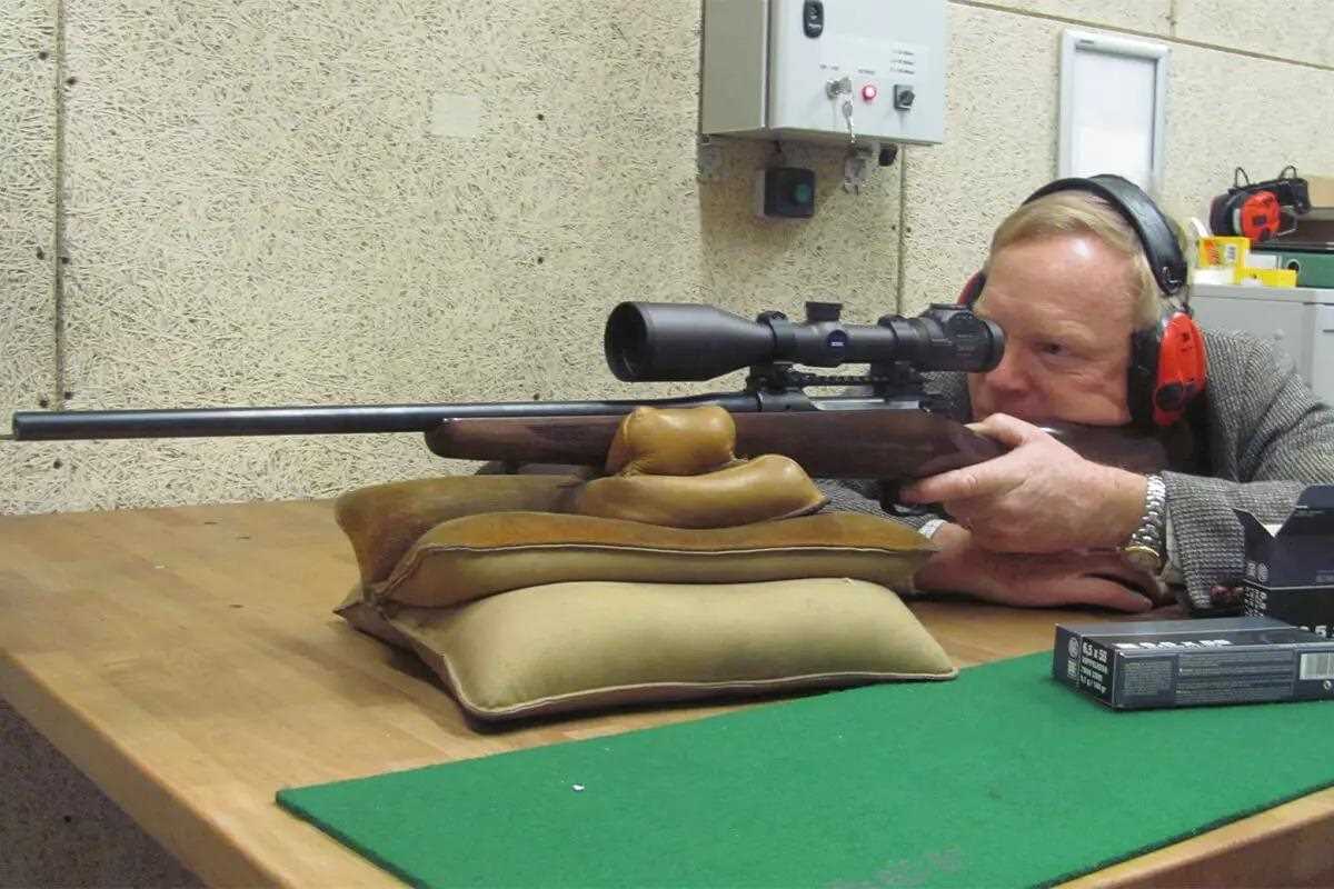 man shooting 6.5x55