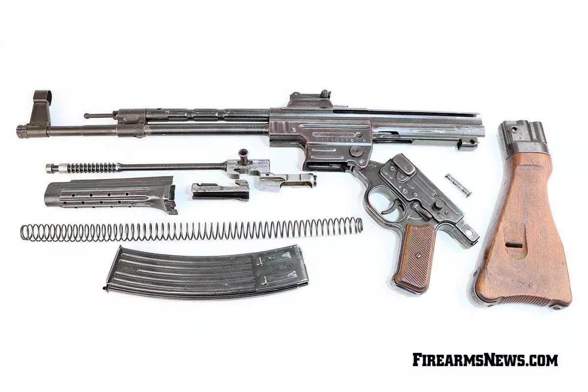 StG 44 rifle disassembled on white background 