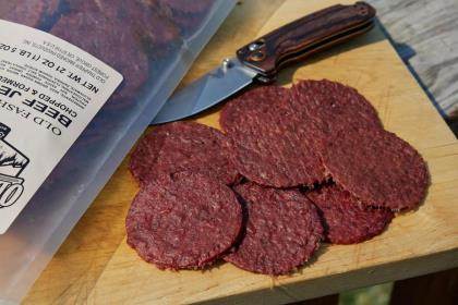 Old Trapper Old-Fashioned Double Eagle Beef Jerky on cutting board