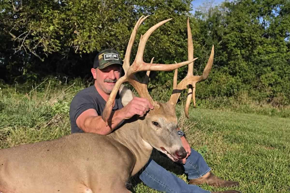 Hunter with buck