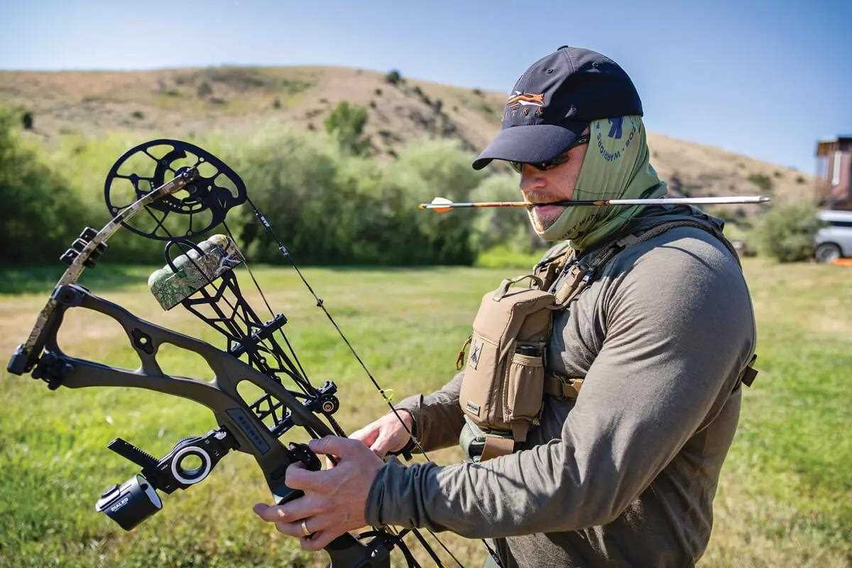 archer nocking an arrow on practice range