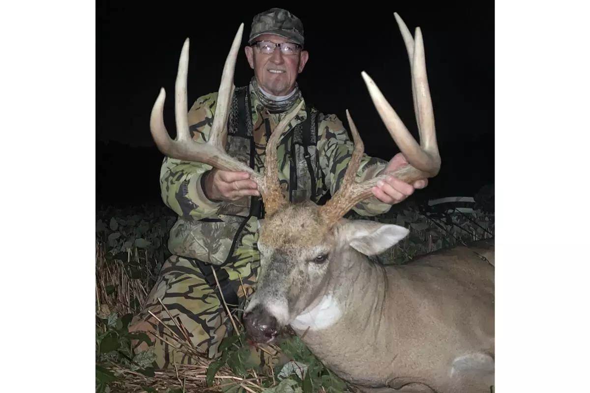 bowhunter poses with big Ohio whitetail buck 