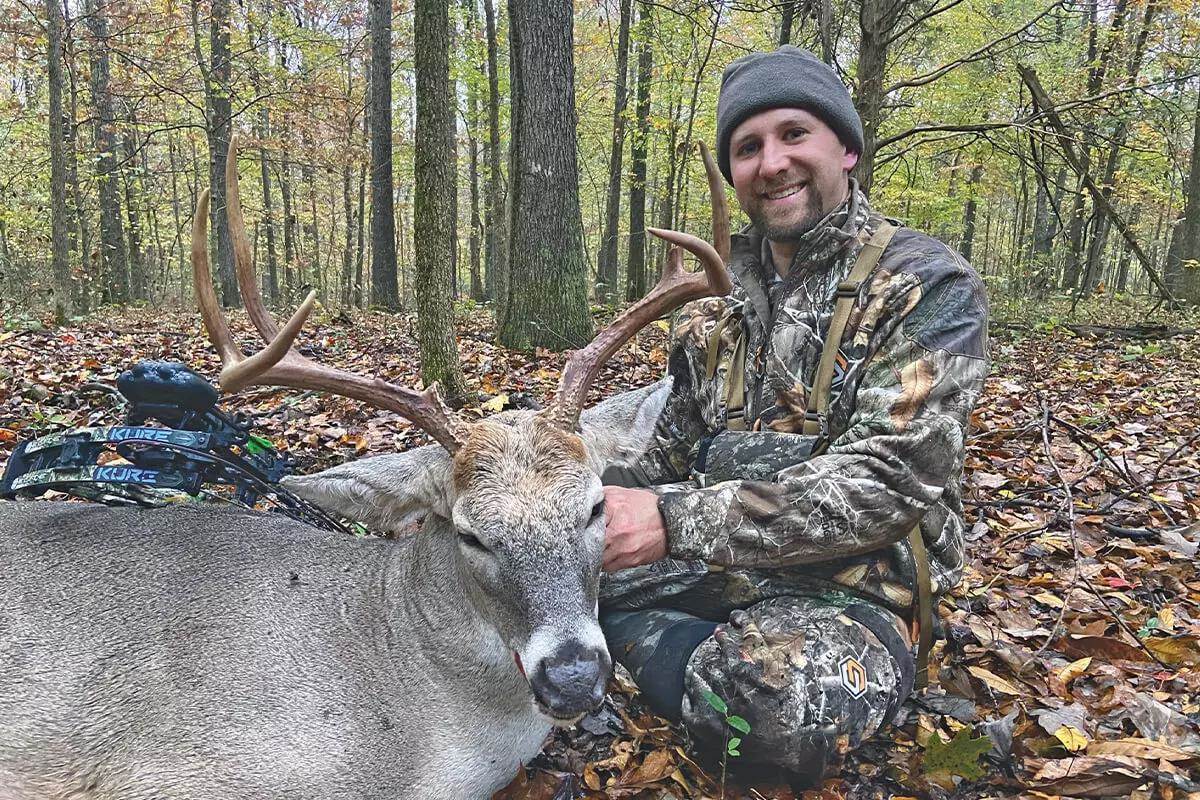 bowhunter with buck