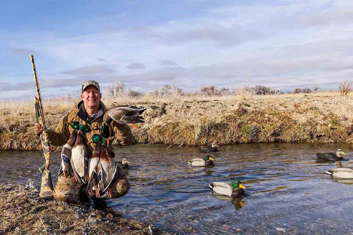 duck hunter in creek