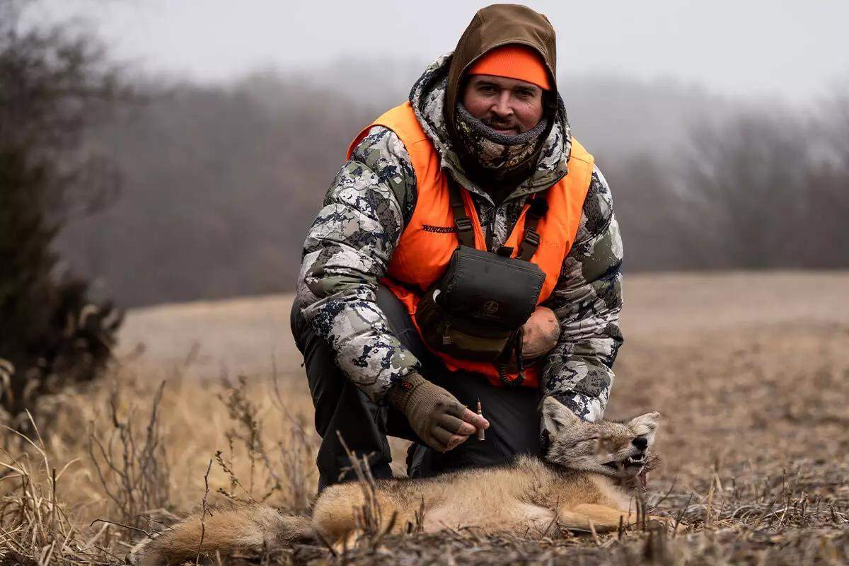 hunter with coyote