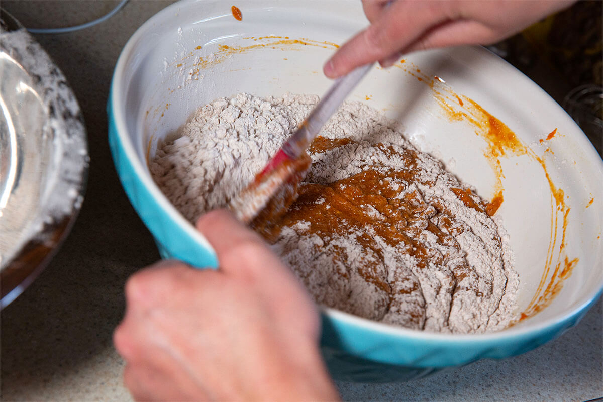 hand mixing in a bowl