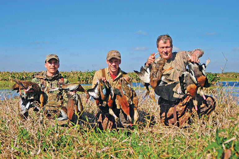 3 hunters with black-bellied ducks